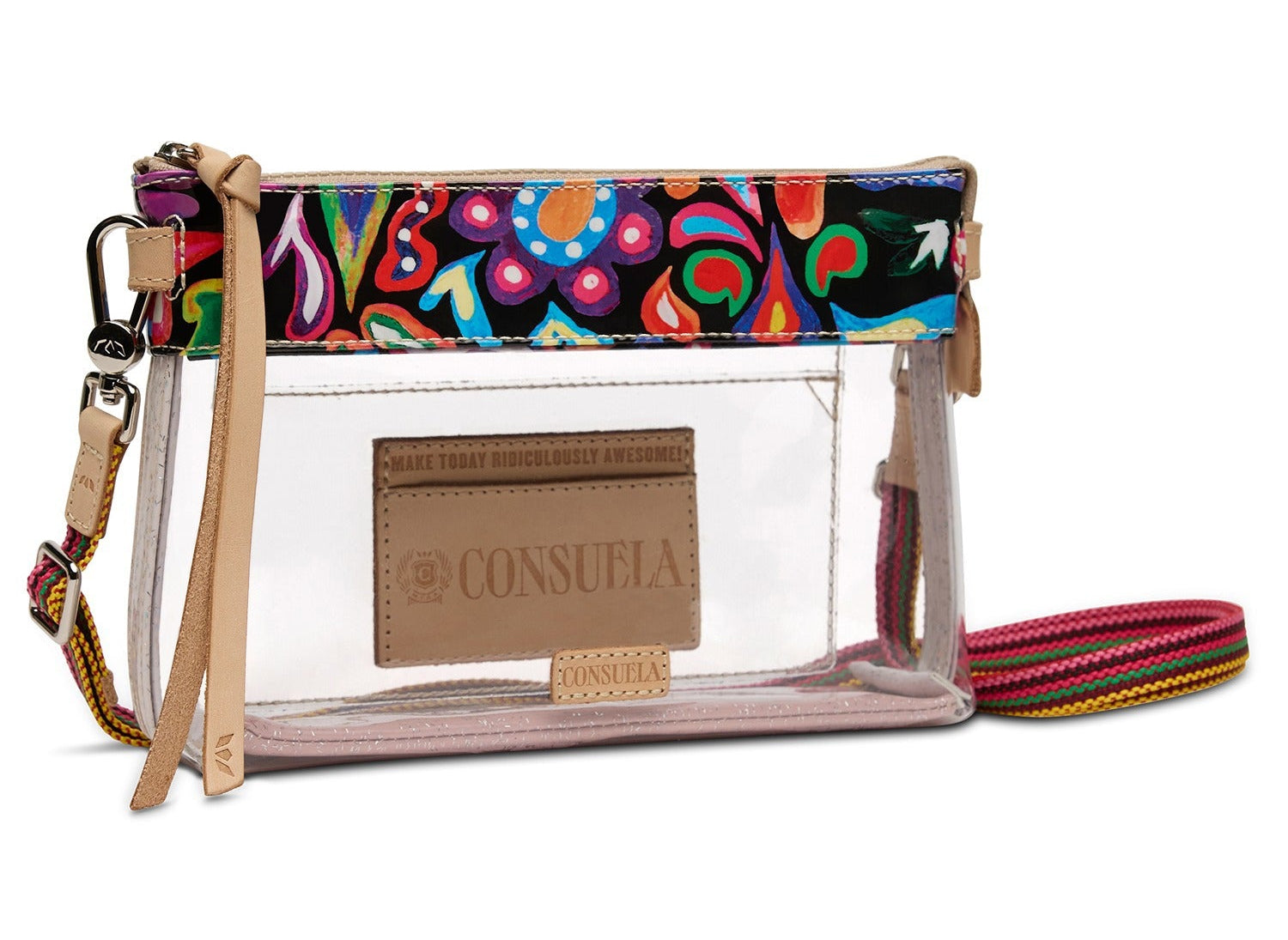 A clear plastic zip-around clutch bag with a colorful abstract patterned top band, beige faux-leather trim and strap, and a tan Consuela brand patch on the front.
