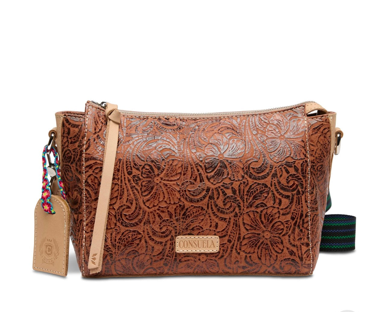 Brown leather handbag with floral patterns on a white background