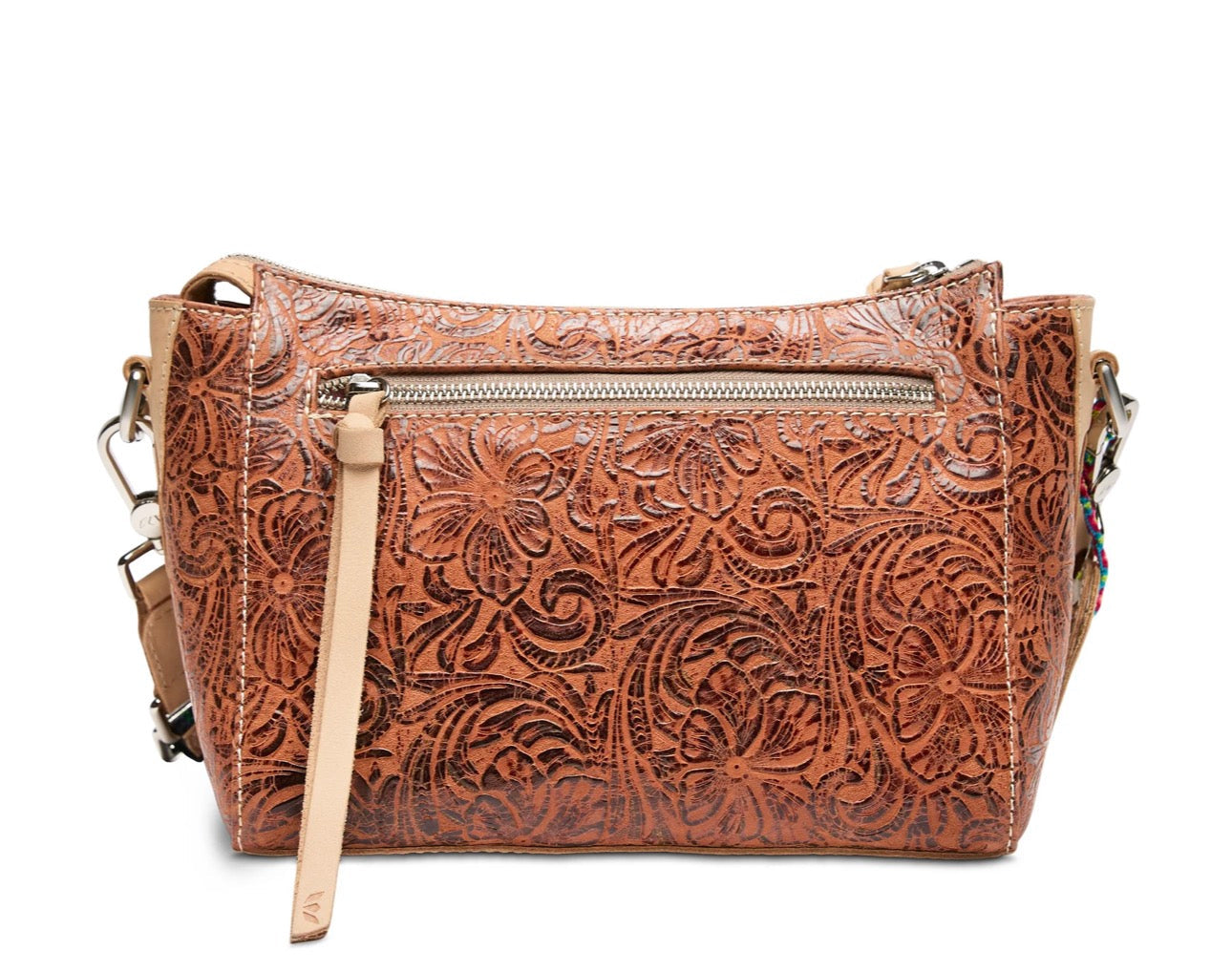 Brown leather handbag with floral embossing on a white background