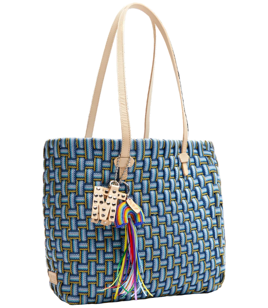 Blue woven handbag with a colorful tassel on a white background
