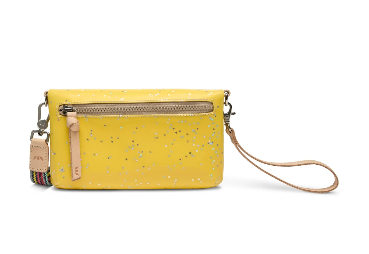 Yellow wristlet with speckled pattern on a white background