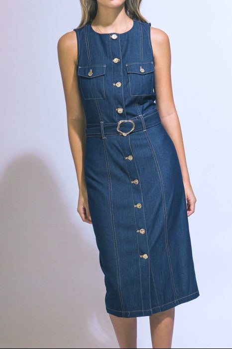 Woman wearing a blue denim dress on a white background