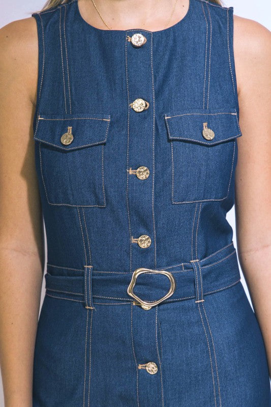 Blue denim dress with gold buttons and belt on a white background