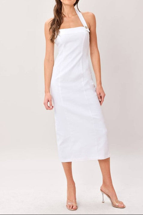 Woman wearing a white halter neck dress on a plain background