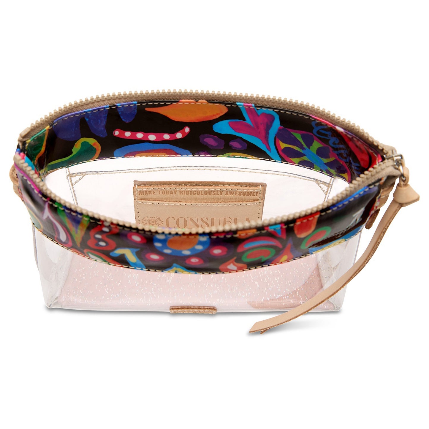 A clear zippered cosmetic pouch with a colorful abstract patterned exterior and a beige interior lining. A tan leather brand patch on the front reads 'GAMERY TERRY SIMPLY SMELLS GREAT.